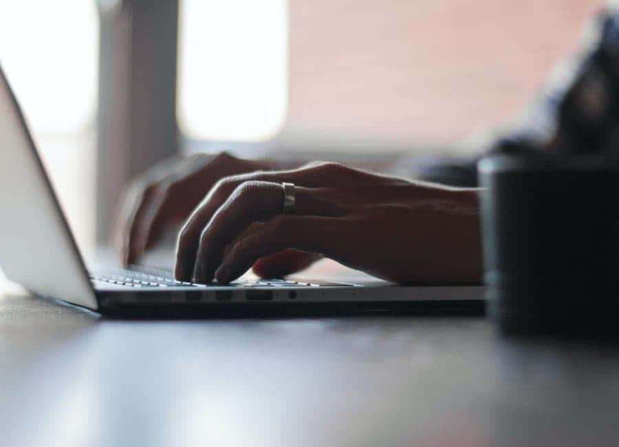 A woman utilizing Record Eraser's expert pardon and expungement experts for help with researching her criminal record in the UJS portal