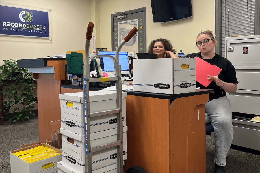 maribel and molly packing up record eraser expungement attorney office